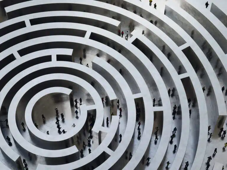 Complicated maze of individuals trying to find their way to their goal. Talent optimization can help organizations improve this dynamic.